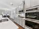 Modern kitchen with stainless steel appliances and an island at 16400 Cozy Cove Rd, Charlotte, NC 28278