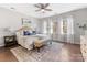 Spacious main bedroom with ceiling fan and wood floors at 16400 Cozy Cove Rd, Charlotte, NC 28278