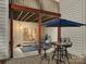 Cozy patio with bistro table and umbrella at 16400 Cozy Cove Rd, Charlotte, NC 28278