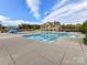 Community pool with a waterslide and clubhouse at 16400 Cozy Cove Rd, Charlotte, NC 28278