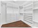 Large walk-in closet with ample shelving and hanging space at 16400 Cozy Cove Rd, Charlotte, NC 28278