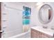 Bathroom featuring a shower-tub combo with tiled walls, a patterned shower curtain, and a vanity with sink at 1648 Newton Dr, Statesville, NC 28677