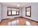 Bedroom with hardwood floors, a ceiling fan, and natural light from two windows at 1648 Newton Dr, Statesville, NC 28677