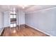 Bedroom with hardwood floors, light gray walls, and a white door at 1648 Newton Dr, Statesville, NC 28677