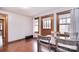 Dining area with a wooden table set for four, three windows and wood-look flooring at 1648 Newton Dr, Statesville, NC 28677