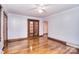 Spacious living room featuring hardwood floors, ceiling fan, and beautiful trim at 1648 Newton Dr, Statesville, NC 28677