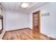 Bright room with hardwood floors, a door with glass panes, and plenty of natural light from the window at 1648 Newton Dr, Statesville, NC 28677