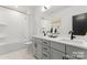 Modern bathroom with double vanity and bathtub at 2149 Highland St, Charlotte, NC 28208