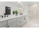 Elegant bathroom with double vanity and large shower at 2149 Highland St, Charlotte, NC 28208