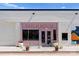 Charming storefront exterior with pink accents, offering a unique and inviting commercial space at 2149 Highland St, Charlotte, NC 28208