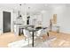 Bright dining room with modern light fixtures and a black dining table at 2149 Highland St, Charlotte, NC 28208