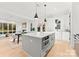 Bright, open kitchen featuring a gray island, modern appliances, and natural light at 2149 Highland St, Charlotte, NC 28208