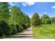 Picturesque walking path lined with lush greenery, offering a tranquil escape in a peaceful setting at 2149 Highland St, Charlotte, NC 28208