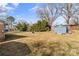 Spacious backyard featuring a storage shed, mature trees, and ample space for outdoor activities at 226 Bradley Farm Rd, Statesville, NC 28625