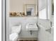 Cozy bathroom with white tile, decorative accents, and a neutral color palette at 226 Bradley Farm Rd, Statesville, NC 28625