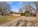 Charming ranch-style home with a covered carport, mature trees, and a well-manicured lawn at 226 Bradley Farm Rd, Statesville, NC 28625