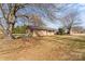 Charming ranch-style home with a covered porch, mature trees, and a well-manicured lawn at 226 Bradley Farm Rd, Statesville, NC 28625