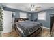 Spacious bedroom with hardwood floors, natural light, ceiling fan, and comfortable sleeping space at 226 Bradley Farm Rd, Statesville, NC 28625