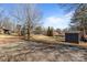 View of spacious backyard with a storage shed at 236 Ervin Rd, Mooresville, NC 28117