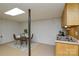 Basement featuring a table with chairs, rug, bar-height countertop, and cabinetry at 236 Ervin Rd, Mooresville, NC 28117