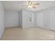 Basement bedroom featuring a window, closet, and ceiling fan at 236 Ervin Rd, Mooresville, NC 28117