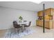 Basement featuring a table with chairs, rug, bar-height countertop, and cabinetry at 236 Ervin Rd, Mooresville, NC 28117