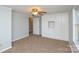 Comfortable bedroom with built-in storage cabinets and a ceiling fan at 236 Ervin Rd, Mooresville, NC 28117