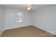 Neutral bedroom with a window offering natural light at 236 Ervin Rd, Mooresville, NC 28117