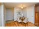 Bright dining area with a glass table and a lovely light fixture at 236 Ervin Rd, Mooresville, NC 28117