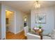 Charming dining area with a glass-top table, seating for four, and a modern light fixture at 236 Ervin Rd, Mooresville, NC 28117