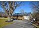 Inviting home boasting a spacious driveway, attached garage, and delightful front porch at 236 Ervin Rd, Mooresville, NC 28117