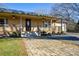 Lovely home showcasing a welcoming front porch, brick paver walkway and manicured landscaping at 236 Ervin Rd, Mooresville, NC 28117