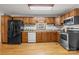 Charming kitchen features wood cabinets, modern appliances, and a bright window over the sink at 236 Ervin Rd, Mooresville, NC 28117