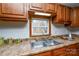 Close-up of a kitchen sink with a window view and ample counter space at 236 Ervin Rd, Mooresville, NC 28117