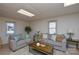 This living room has neutral walls and features two sofas, a coffee table and natural light from two windows at 236 Ervin Rd, Mooresville, NC 28117