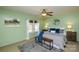 Cozy main bedroom with a ceiling fan, two bedside tables, and an accent bench at 236 Ervin Rd, Mooresville, NC 28117