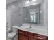 Bathroom featuring a vanity with dark wood cabinets and a single sink and a tub/shower at 2415 Impatien Dr, Charlotte, NC 28215