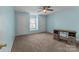 Bedroom with carpeted floors, a window and two doors, and a desk with storage space at 2415 Impatien Dr, Charlotte, NC 28215