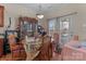 Cozy dining room with table, chairs, hutch, and door to outside covered area at 2415 Impatien Dr, Charlotte, NC 28215