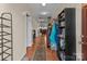 Hallway with wood floors and view into the living room at 2415 Impatien Dr, Charlotte, NC 28215