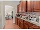 Kitchen counter with modern appliances, granite countertops and hardwood cabinets at 2415 Impatien Dr, Charlotte, NC 28215