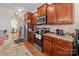 Bright kitchen features stainless steel appliances, wood cabinets, and granite countertops at 2415 Impatien Dr, Charlotte, NC 28215