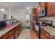 Well-lit kitchen with stainless steel appliances, granite countertops and hardwood floors at 2415 Impatien Dr, Charlotte, NC 28215