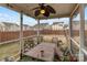 Screened patio with ceiling fan and furnishings offers outdoor living space at 2415 Impatien Dr, Charlotte, NC 28215