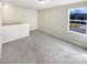 Upstairs bedroom with window and grey carpet at 271 Wendover Dr, Salisbury, NC 28147