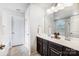 Bathroom features a double sink vanity with dark wood cabinets and white countertop, and a separate tub at 2727 Cypress Oak Ln, Gastonia, NC 28056