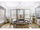 Bright dining room features a dark wood table set with six chairs and decor sitting on an area rug at 2727 Cypress Oak Ln, Gastonia, NC 28056