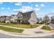 Two-story home showcasing manicured landscaping, attached garage, and charming neighborhood views at 2727 Cypress Oak Ln, Gastonia, NC 28056