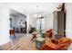 Bright living room featuring hardwood floors, a chandelier, and stylish furniture arrangement at 2727 Cypress Oak Ln, Gastonia, NC 28056