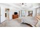 Large main bedroom with a tray ceiling, ceiling fan, natural light and neutral carpet and paint at 2727 Cypress Oak Ln, Gastonia, NC 28056